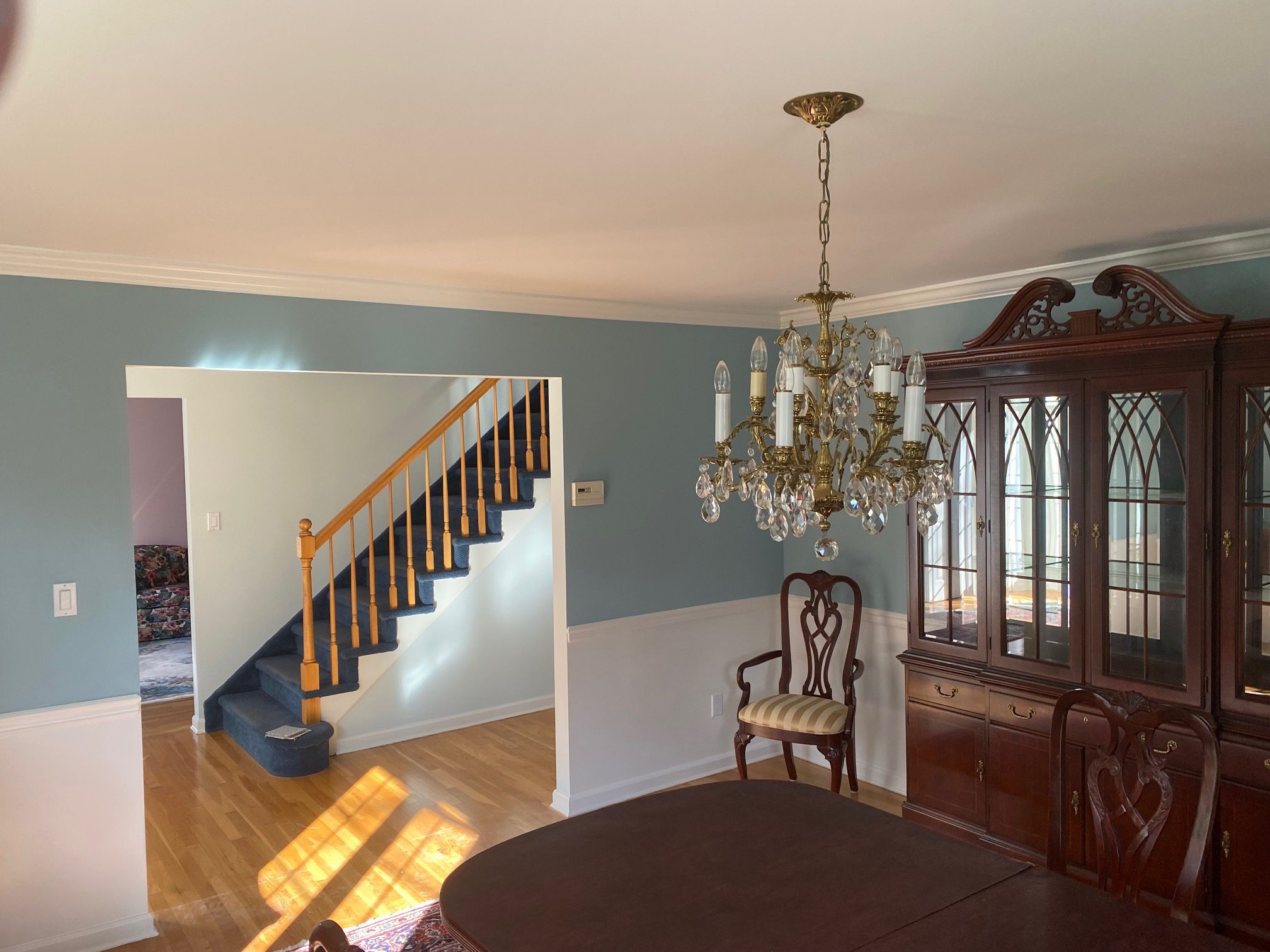 Traditional dining room with chandelier and china cabinet