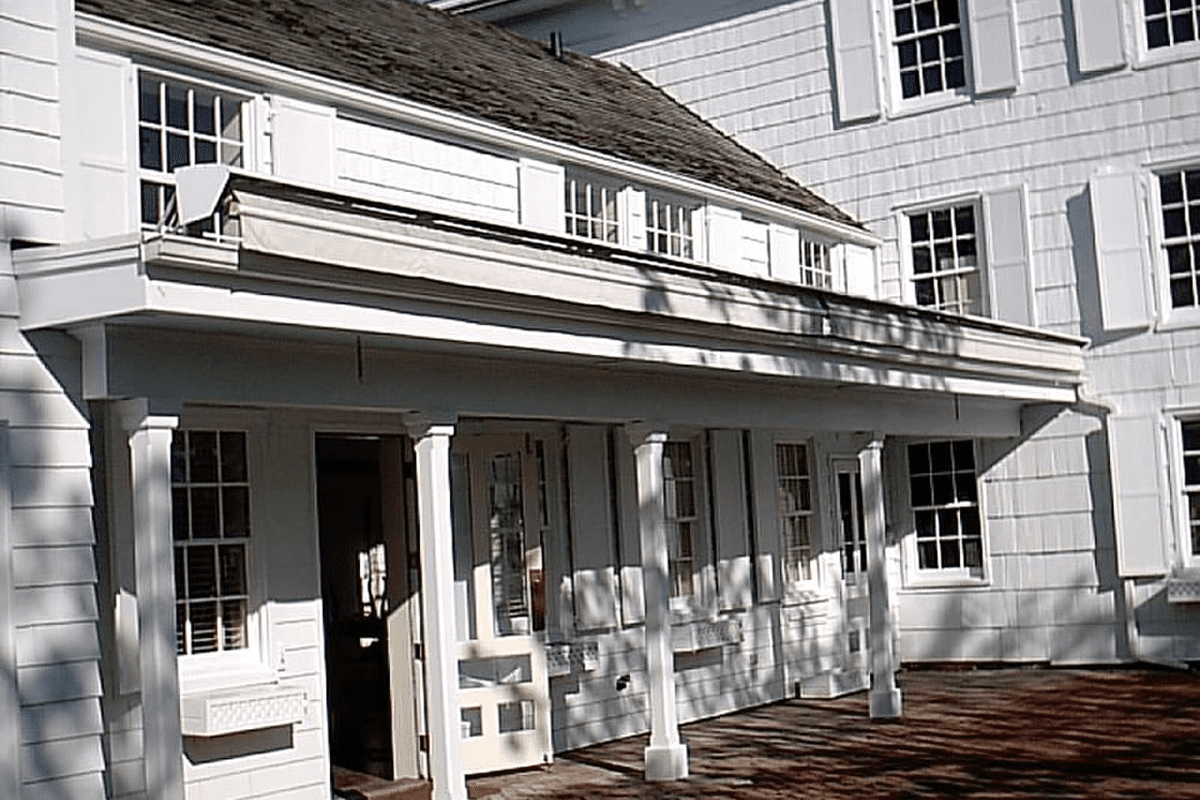 White colonial house with porch and columns